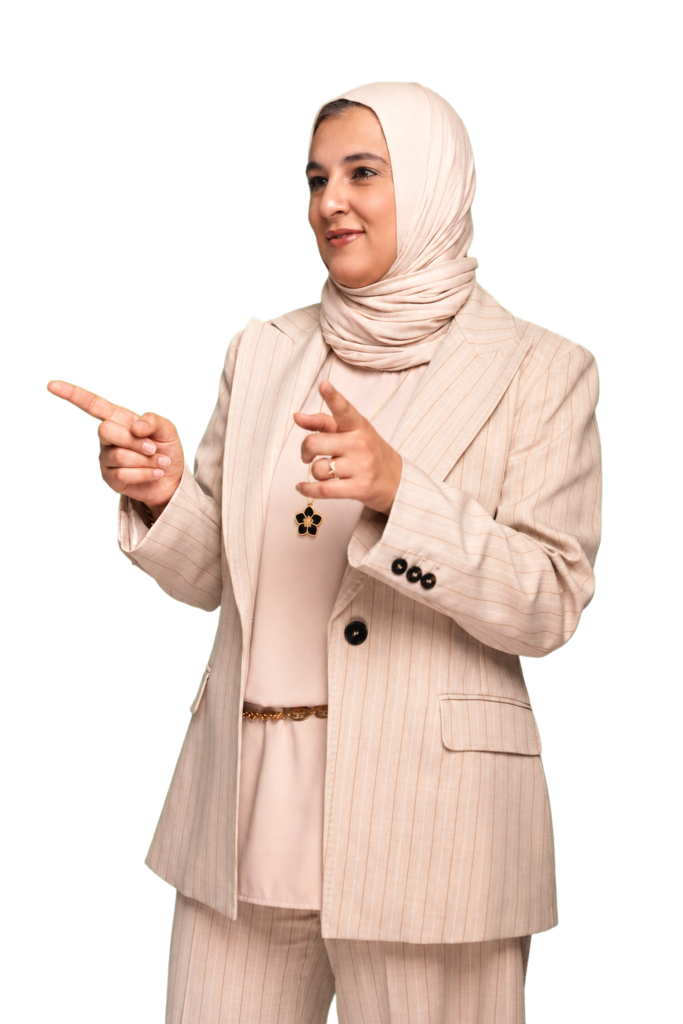 Dr. Shikha A. Ebrahim pointing toward the homepage message
